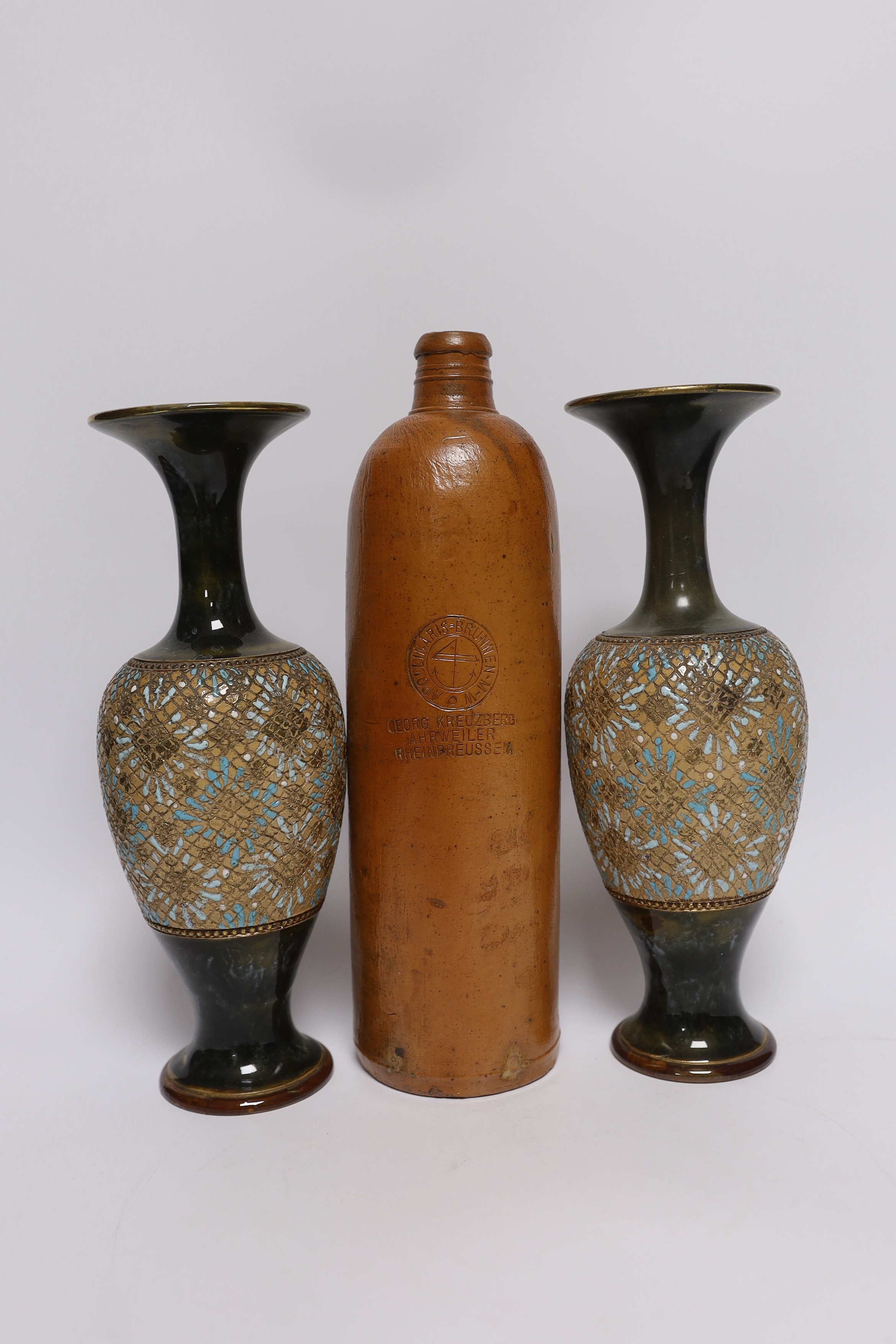 A pair of Doulton Lambeth vases, three jars, two with covers and a Georg Kreuzberg terracotta bottle
